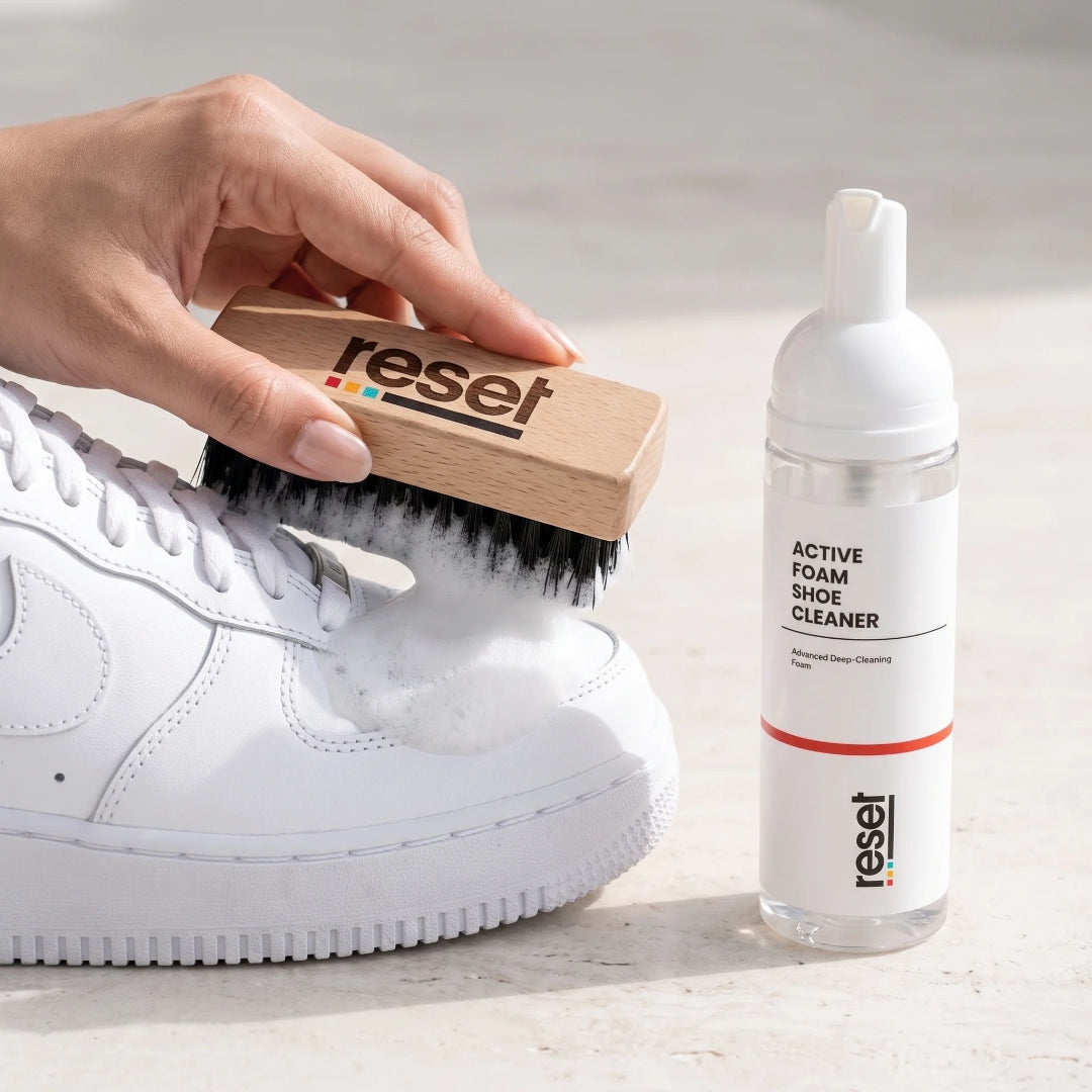 How to use RESET — applying foam to a white sneaker with the reset brush