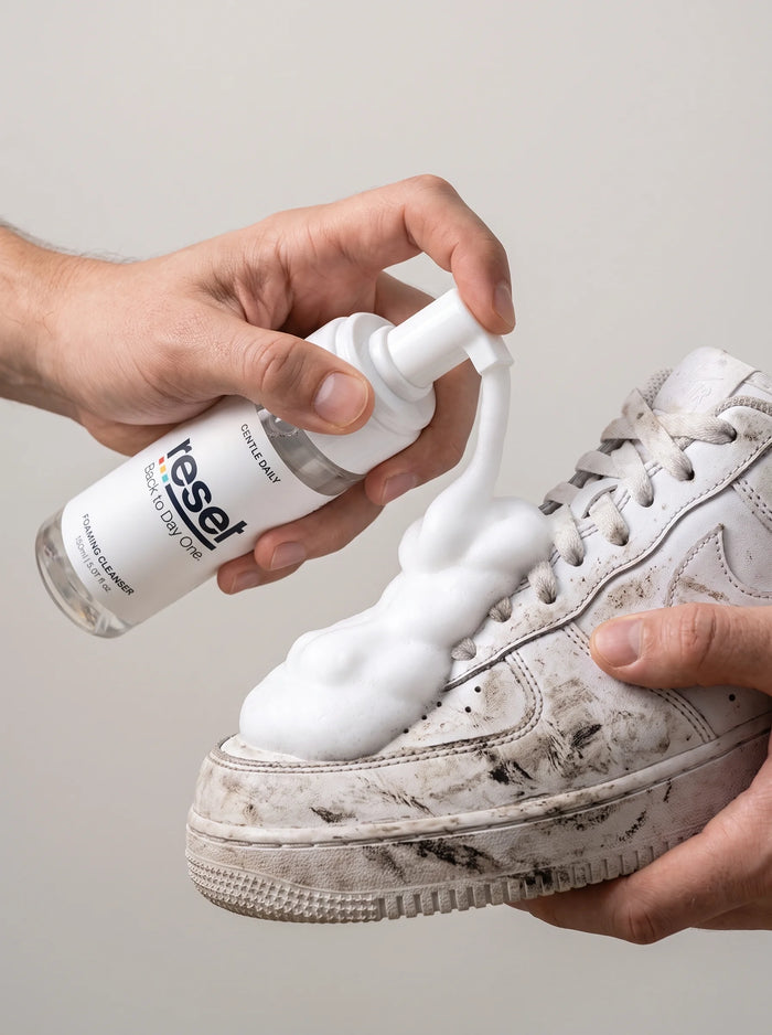 RESET step 1 — apply foam to a dirty sneaker